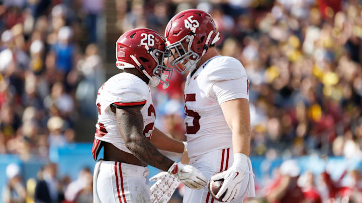 Dec 31, 2024; Tampa, FL, USA; Alabama Crimson Tide tight end Robbie Ouzts (45) celebrates a touchdown with  running back Jam Miller (26) during the first half at Raymond James Stadium. Mandatory Credit: Matt Pendleton-Imagn Images