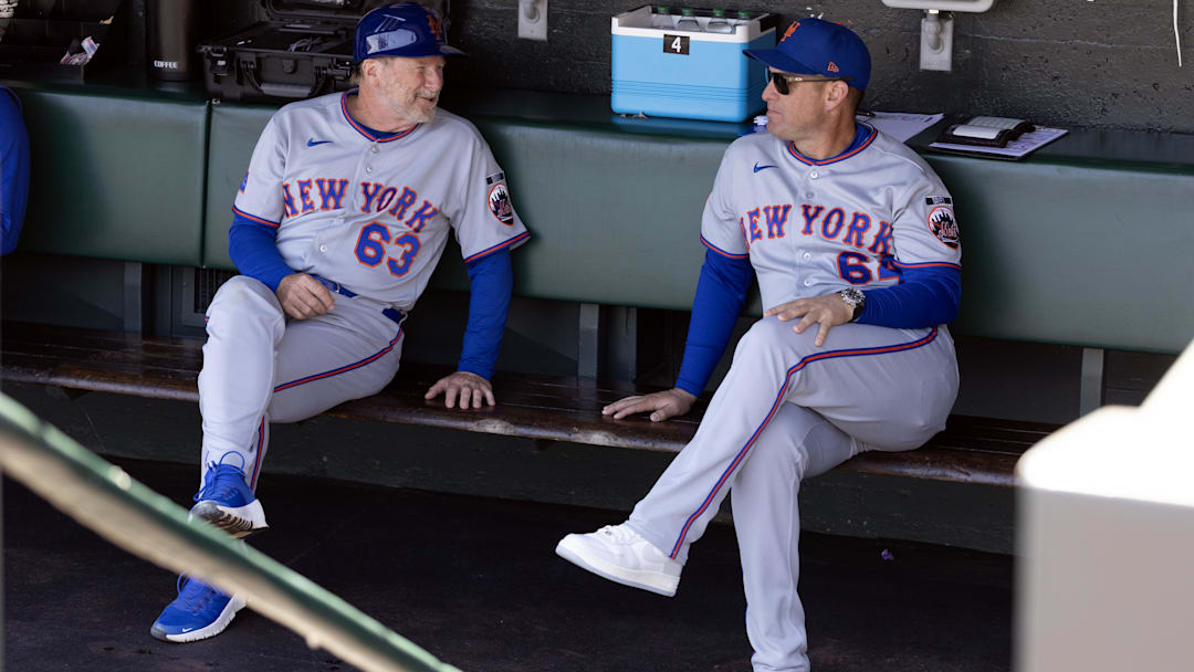 New York Mets third base coach Tim Leiper and manager Carlos Mendoza.