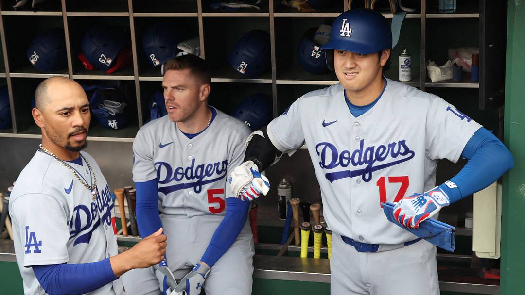 Jun 9, 2026; Pittsburgh, Pennsylvania, USA;  Los Angeles Dodgers shortstop Mookie Betts (50) and designated hitter Shohei Ohtani (17) and first baseman Freddie Freeman (5) prepare in the dugout before the first inning against the Pittsburgh Pirates at PNC Park. Mandatory Credit: Charles LeClaire-Imagn Images