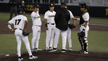 April 2, 2025; Columbia, Missouri, USA: Missouri head coach Kerrick Jackson talks with his players during a pitching change. 