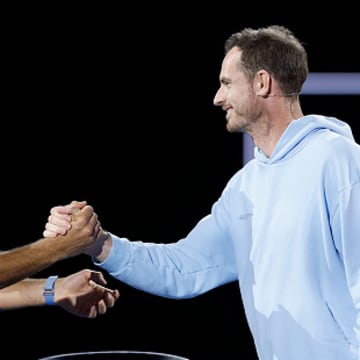 Novak Djokovic and Andy Murray shake hands while warming up for the Australian Open.