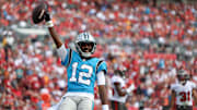 Jan 1, 2023; Tampa, Florida, USA;  Carolina Panthers wide receiver Shi Smith (12) celebrates afar scoring a touchdown  against the Tampa Bay Buccaneers in the fourth quarter at Raymond James Stadium. Mandatory Credit: Nathan Ray Seebeck-Imagn Images