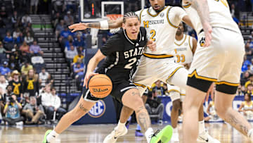 Mar 13, 2025; Nashville, TN, USA;  Mississippi State Bulldogs forward RJ Melendez (22) dribbles past Missouri Tigers guard Tamar Bates (2) during the second half at Bridgestone Arena. Mandatory Credit: Steve Roberts-Imagn Images