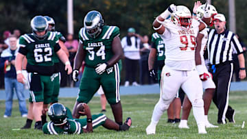 Bergen Catholic's Jayden Beckley, right, celebrates after making a sack during the football game between Bergen Catholic and Winslow played at Winslow Township High School on Friday, September 12, 2025.