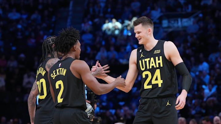 Feb 18, 2023; Salt Lake City, UT, USA; Team Jazz guard Jordan Clarkson (00), guard Collin Sexton (2) and center Walker Kessler (24) celebrate after winning the Skills Competition during the 2023 All Star Saturday Night at Vivint Arena. Mandatory Credit: Kyle Terada-Imagn Images