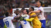 France celebrate their penalty shootout triumph against Portugal