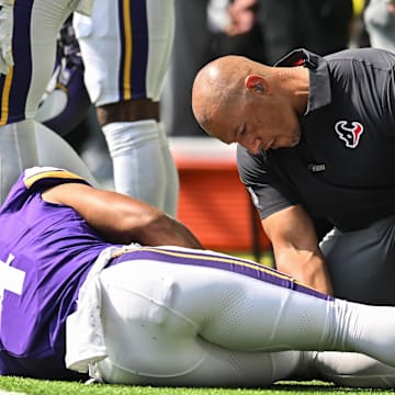 Aug 9, 2025; Minneapolis, Minnesota, USA; Minnesota Vikings wide receiver Rondale Moore (4) is quickly attended to by a Houston Texans trainer after suffering a lower leg injury during the second quarter at U.S. Bank Stadium. Mandatory Credit: Jeffrey Becker-Imagn Images
