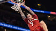 Arkansas Razorbacks forward Trevon Brazile (7) dunks the ball against the Memphis Tigers during the second half at FedEx Forum. 