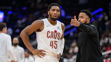 Oct 26, 2024; Washington, District of Columbia, USA; Cleveland Cavaliers guard Donovan Mitchell (45) speaks to Cleveland Cavaliers associate head coach Johnnie
Bryant during a time out in the third quarter against the Washington Wizards at Capital One Arena. Mandatory Credit: Reggie Hildred-Imagn Images
