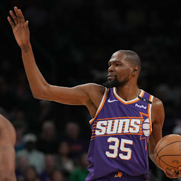 Kevin Durant calls a play against the Celtics.