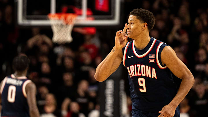 Arizona Wildcats forward Carter Bryant (9) gestures after hitting a 3-point basket in the second half of the NCAA basketball game against the Cincinnati Bearcats at the Fifth Third Arena in Cincinnati on Saturday, January 4, 2025.