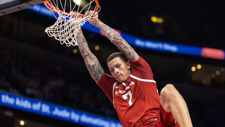 Arkansas Razorbacks forward Trevon Brazile (7) dunks the ball against the Memphis Tigers during the second half at FedEx Forum. Arkansas Razorbacks forward Trevon Brazile (7) dunks the ball against the Memphis Tigers during the second half at FedEx Forum.