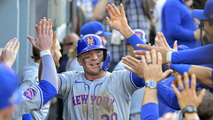 Oct 14, 2024; Los Angeles, California, USA; New York Mets first baseman Pete Alonso (20) celebrates in the dugout after scoring in the ninth inning against the Los Angeles Dodgers during game two of the NLCS for the 2024 MLB Playoffs at Dodger Stadium. Mandatory Credit: Jayne Kamin-Oncea-Imagn Images Oct 14, 2024; Los Angeles, California, USA; New York Mets first baseman Pete Alonso (20) celebrates in the dugout after scoring in the ninth inning against the Los Angeles Dodgers during game two of the NLCS for the 2024 MLB Playoffs at Dodger Stadium. Mandatory Credit: Jayne Kamin-Oncea-Imagn Images
