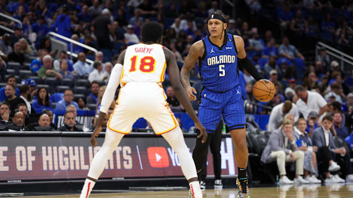 Apr 15, 2025; Orlando, Florida, USA; Orlando Magic forward Paolo Banchero (5) is guarded by Atlanta Hawks forward Mouhamed Gueye (18) in the third quarter at Kia Center. Mandatory Credit: Nathan Ray Seebeck-Imagn Images Apr 15, 2025; Orlando, Florida, USA; Orlando Magic forward Paolo Banchero (5) is guarded by Atlanta Hawks forward Mouhamed Gueye (18) in the third quarter at Kia Center. Mandatory Credit: Nathan Ray Seebeck-Imagn Images