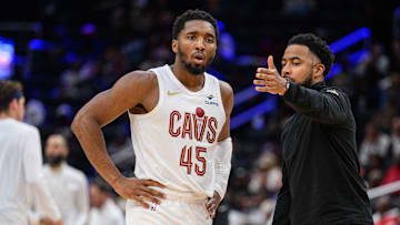 Oct 26, 2024; Washington, District of Columbia, USA; Cleveland Cavaliers guard Donovan Mitchell (45) speaks to Cleveland Cavaliers associate head coach Johnnie
Bryant during a time out in the third quarter against the Washington Wizards at Capital One Arena. Mandatory Credit: Reggie Hildred-Imagn Images