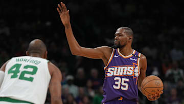 Mar 26, 2025; Phoenix, Arizona, USA; Phoenix Suns forward Kevin Durant (35) calls out a play against the Boston Celtics during the first half at Footprint Center. Mandatory Credit: Rick Scuteri-Imagn Images