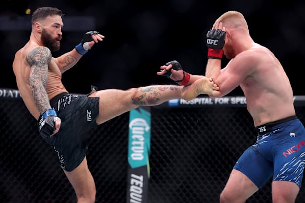 Bo Nickal (red gloves) fights Paul Craig (blue gloves) in the middleweight bout during UFC 309 at Madison Square Garden.
