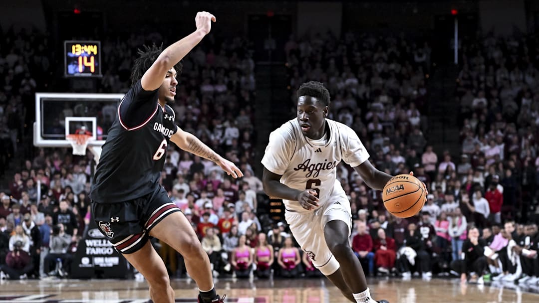 Jan 24, 2026; College Station, Texas, USA; Texas A&M Aggies guard Ali Dibba (6) drives against South Carolina Gamecocks forward EJ Walker (6) during the first half at Reed Arena. Mandatory Credit: Maria Lysaker-Imagn Images 