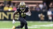 Sep 14, 2025; New Orleans, Louisiana, USA;  New Orleans Saints running back Alvin Kamara (41) runs against the San Francisco 49ers during the first half at Caesars Superdome. Mandatory Credit: Stephen Lew-Imagn Images