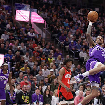 Mar 29, 2024; Salt Lake City, Utah, USA;  Utah Jazz forward John Collins (20) is fouled while shooting the ball during the first quarter at Delta Center. Mandatory Credit: Chris Nicoll-Imagn Images