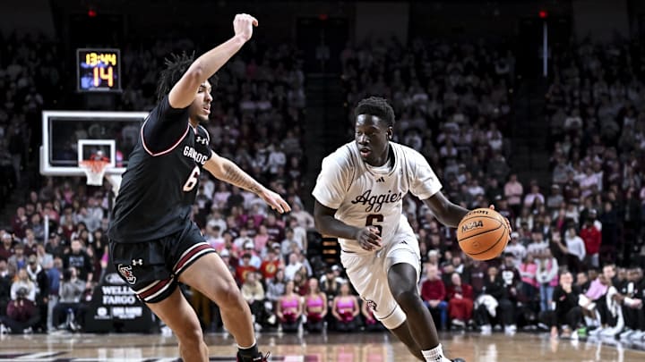 Jan 24, 2026; College Station, Texas, USA; Texas A&M Aggies guard Ali Dibba (6) drives against South Carolina Gamecocks forward EJ Walker (6) during the first half at Reed Arena. Mandatory Credit: Maria Lysaker-Imagn Images 