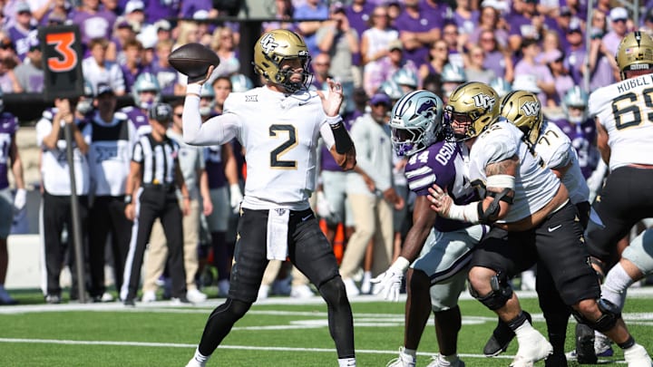 Sep 27, 2025; Manhattan, Kansas, USA; UCF Knights quarterback Tayven Jackson (2) drops back to pass during the first quarter against the Kansas State Wildcats at Bill Snyder Family Football Stadium. Mandatory Credit: Scott Sewell-Imagn Images Sep 27, 2025; Manhattan, Kansas, USA; UCF Knights quarterback Tayven Jackson (2) drops back to pass during the first quarter against the Kansas State Wildcats at Bill Snyder Family Football Stadium. Mandatory Credit: Scott Sewell-Imagn Images