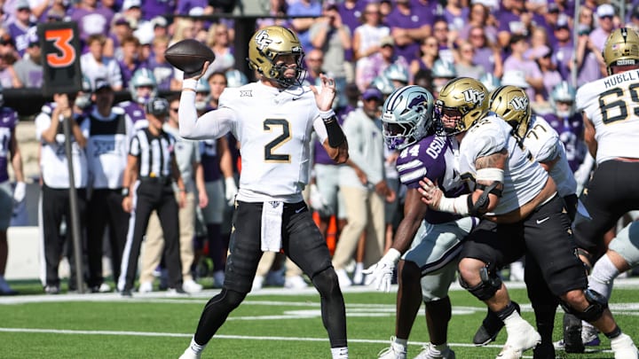 Sep 27, 2025; Manhattan, Kansas, USA; UCF Knights quarterback Tayven Jackson (2) drops back to pass during the first quarter against the Kansas State Wildcats at Bill Snyder Family Football Stadium. Mandatory Credit: Scott Sewell-Imagn Images Sep 27, 2025; Manhattan, Kansas, USA; UCF Knights quarterback Tayven Jackson (2) drops back to pass during the first quarter against the Kansas State Wildcats at Bill Snyder Family Football Stadium. Mandatory Credit: Scott Sewell-Imagn Images
