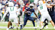 Nov 22, 2025; Tucson, Arizona, USA; Arizona Wildcats running back Ismail Mahdi (21) against the Baylor Bears at Casino Del Sol Stadium. Mandatory Credit: Mark J. Rebilas-Imagn Images