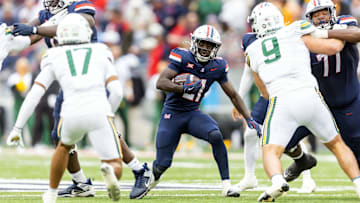 Nov 22, 2025; Tucson, Arizona, USA; Arizona Wildcats running back Ismail Mahdi (21) against the Baylor Bears at Casino Del Sol Stadium. Mandatory Credit: Mark J. Rebilas-Imagn Images