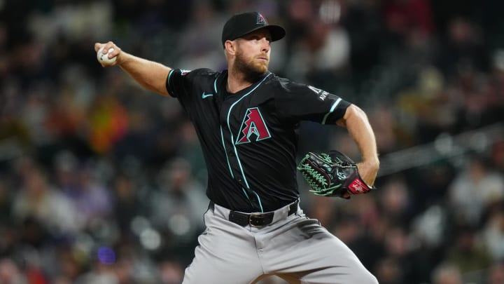 Apr 9, 2024; Denver, Colorado, USA; Arizona Diamondbacks starting pitcher Merrill Kelly (29) delivers a pitch in the fifth inning against the Colorado Rockies at Coors Field. Mandatory Credit: Ron Chenoy-USA TODAY Sports