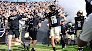 Purdue Boilermakers quarterback Ryan Browne (15) runs out of the tunnel