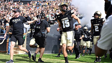 Purdue Boilermakers quarterback Ryan Browne (15) runs out of the tunnel 