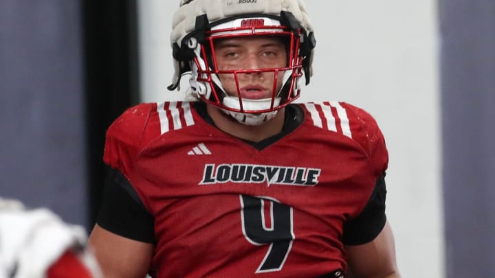 Louisville defensive end Ashton Gillotte warms up for spring practice.