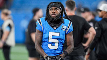 Diontae Johnson watches during the second half of a Panthers game.