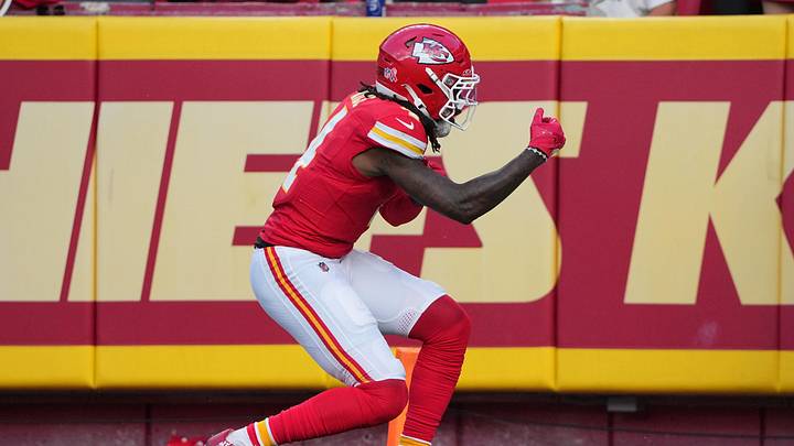 Sep 15, 2024; Kansas City, Missouri, USA; Kansas City Chiefs wide receiver Rashee Rice (4) celebrates after scoring against the Cincinnati Bengals during the game at GEHA Field at Arrowhead Stadium. Mandatory Credit: Denny Medley-Imagn Images