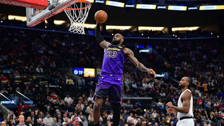 Jan 19, 2025; Inglewood, California, USA; Los Angeles Lakers forward LeBron James (23) dunks for the basket in front of Los Angeles Clippers forward Kawhi Leonard (2) during the second half at Intuit Dome. Mandatory Credit: Gary A. Vasquez-Imagn Images