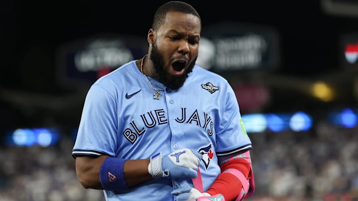 Oct 29, 2025; Los Angeles, California, USA; Toronto Blue Jays first baseman Vladimir Guerrero Jr. (27) reacts after grounding into a double play during the fifth inning against the Los Angeles Dodgers during game five of the 2025 MLB World Series at Dodger Stadium. Mandatory Credit: Kiyoshi Mio-Imagn Images