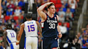 Mar 23, 2025; Raleigh, NC, USA; Connecticut Huskies forward Liam McNeeley (30) reacts after scoring a basket during the second half against the Florida Gators in the second round of the NCAA Tournament at Lenovo Center. Mandatory Credit: Zachary Taft-Imagn Images