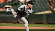 Jul 13, 2025; Baltimore, Maryland, USA;  Miami Marlins relief pitcher Josh Simpson (66) delivers a pitch during the ninth inning against the Baltimore Orioles at Oriole Park at Camden Yards. Mandatory Credit: James A. Pittman-Imagn Images
