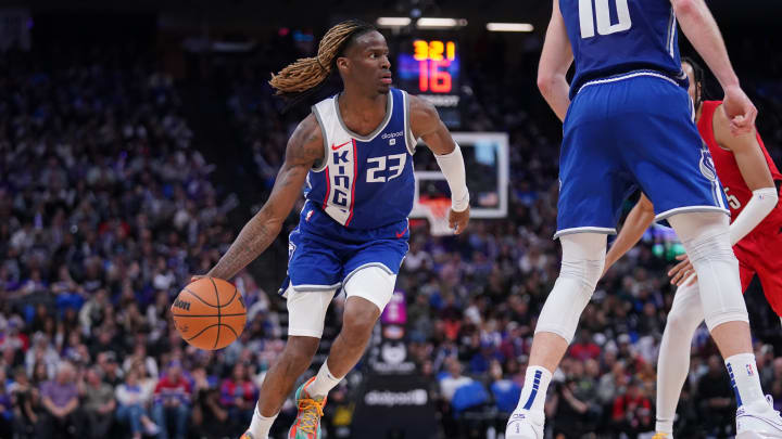 Apr 14, 2024; Sacramento, California, USA; Sacramento Kings guard Keon Ellis (23) dribbles the ball against the Portland Trail Blazers in the third quarter at the Golden 1 Center. Mandatory Credit: Cary Edmondson-USA TODAY Sports