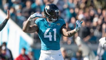 Dec 31, 2023; Jacksonville, Florida, USA; Jacksonville Jaguars linebacker Josh Allen (41) celebrates a sack against the Carolina Panthers in the second quarter at EverBank Stadium. Mandatory Credit: Jeremy Reper-USA TODAY Sports