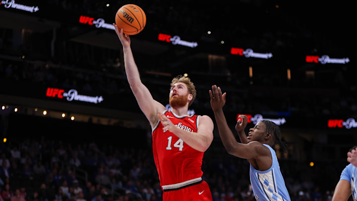 Dec 20, 2025; Atlanta, Georgia, USA; Ohio State Buckeyes forward Brandon Noel (14) shoots against the North Carolina Tar Heels in the first half at State Farm Arena. Mandatory Credit: Brett Davis-Imagn Images
