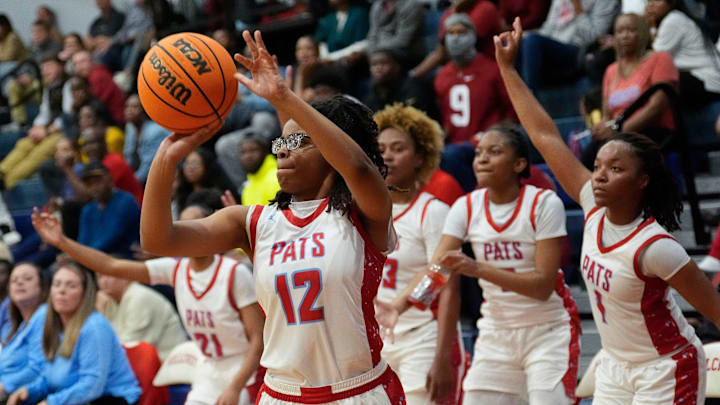 Hillcrest guard Madison Ivey-Dowdell (12) shoots a three at Hillcrest High School Tuesday, Dec. 10, 2024. Hillcrest downed Vestavia Hills 71-45. Hillcrest guard Madison Ivey-Dowdell (12) shoots a three at Hillcrest High School Tuesday, Dec. 10, 2024. Hillcrest downed Vestavia Hills 71-45.
