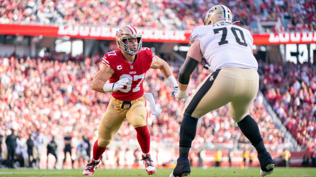 San Francisco 49ers defensive end Nick Bosa (97) rushes against New Orleans Saints tackle Trevor Penning (70) 