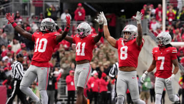 Oct. 7, 2023; Columbus, Oh., USA; 
Ohio State Buckeyes safety Lathan Ransom (8) celebrates with Ohio State Buckeyes cornerback Denzel Burke (10) and Ohio State Buckeyes safety Josh Proctor (41) after intercepting off a pass during the second half of Saturday's NCAA Division I football game against the Maryland Terrapins at Ohio Stadium.