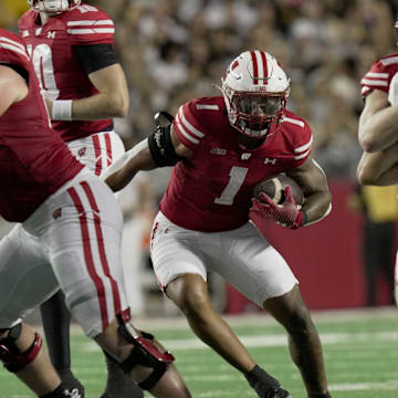 Wisconsin running back Chez Mellusi (1) finds a hole in the Western Michigan defense during the second quarter of their game Friday, August 30, 2024 at Camp Randall Stadium in Madison, Wisconsin.