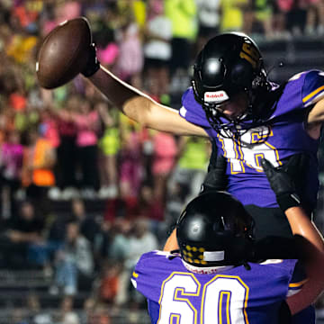 Waukee's Lucas Peterson (16) celebrates a touchdown with Colt Schipper (60) during a game between Waukee and Sioux City North on Friday, Sept. 13, 2024, in Waukee.