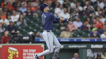 Aug 2, 2024; Houston, Texas, USA; Tampa Bay Rays left fielder Dylan Carlson (10) hits a home run during the first inning against the Houston Astros at Minute Maid Park. Mandatory Credit: Troy Taormina-USA TODAY Sports