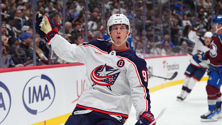 Oct 12, 2024; Denver, Colorado, USA; Columbus Blue Jackets center Kent Johnson (91) celebrates his goal scored in the first period against the Colorado Avalanche at Ball Arena. Mandatory Credit: Ron Chenoy-Imagn Images
