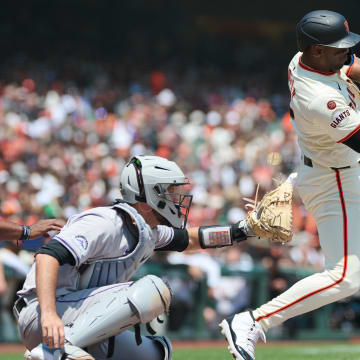 Jul 28, 2024; San Francisco, California, USA; San Francisco Giants designated hitter Jorge Soler (2) hits an RBI triple against the Colorado Rockies during the second inning at Oracle Park. 